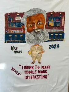 A Hand-painted Hemingway t-shirt - I drink to make people more interesting.